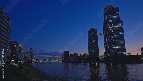 Night light Tokyo, Tsukuda, Toyosu skyscrapers and bridge the Sumida River Yakatabune, pleasure boat photo