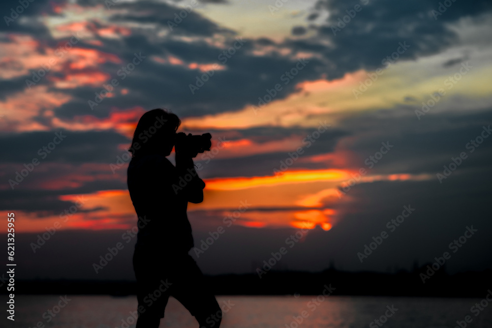 The Photographer Girl at the Sunset Time