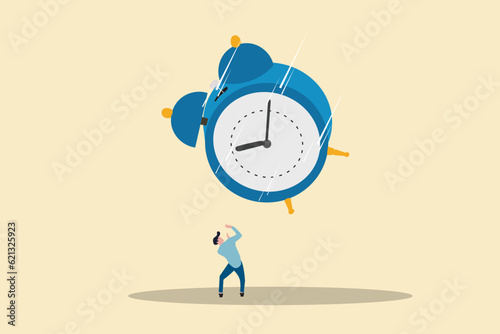 Businessman afraid with big clock falling down. concept of Run out of time, work deadline and time countdown photo