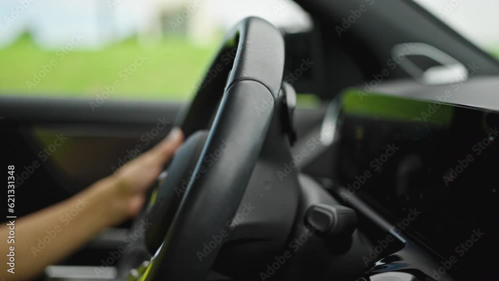 Middle age hispanic woman driving a car on the road