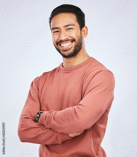 Tableau sur toile Portrait, smile and Asian man with arms crossed, casual fashion and confident guy against a white studio background