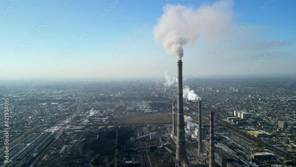 Bishkek thermal power station, 2/3 shot of the smoke chimneys and the city Bishkek thermal power station, 2/3 shot of the smoke chimneys and the city