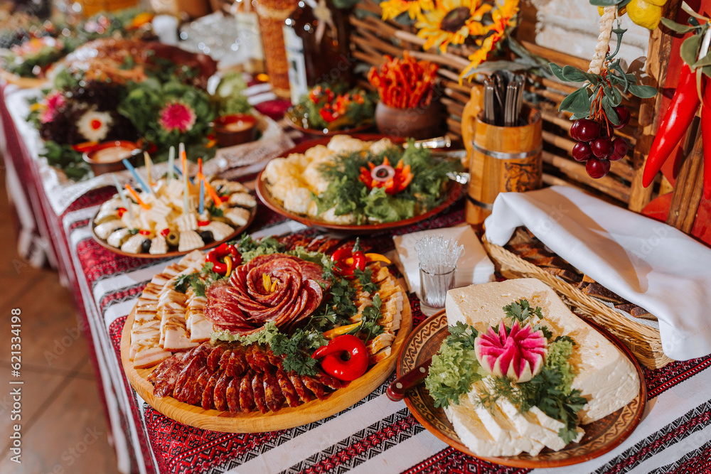 Cossack table in the best restaurants. Festive table at the wedding. National Ukrainian cuisine. Fat, sausages, alcohol. Catering.