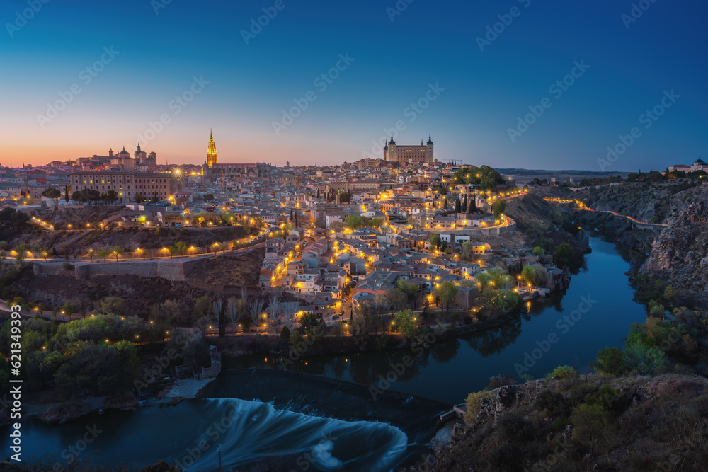 Toledo Skyline with Cathedral, Alcazar and Tagus River at night - Toledo, Spain