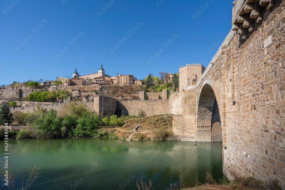 Toledo Skyline with Alcazar of Toledo, Alcantara Bridge and Tagus River - Toledo, Spain