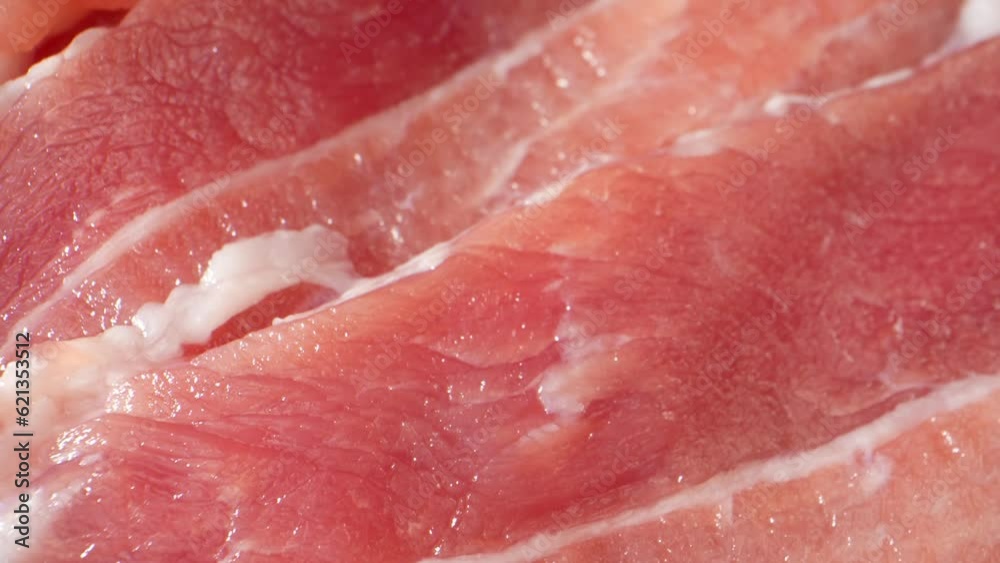 Mesmerizing macro video of raw pork belly slices captured with a probe lens, showcasing its exquisite marbling and texture in stunning detail. Meat industry. Food concept. Pork background. 4K HDR
Mesmerizing macro video of raw pork belly slices captured with a probe lens, showcasing its exquisite marbling and texture in stunning detail. Meat industry. Food concept. Pork background. 4K HDR
