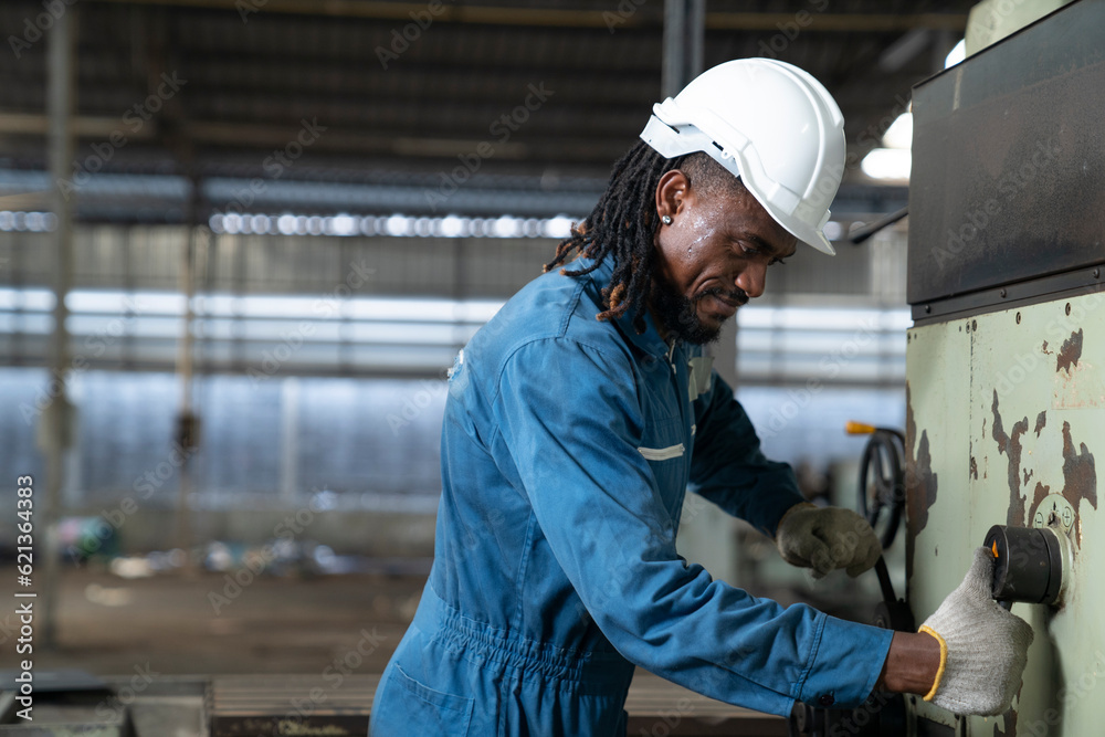 African engineer working at factory