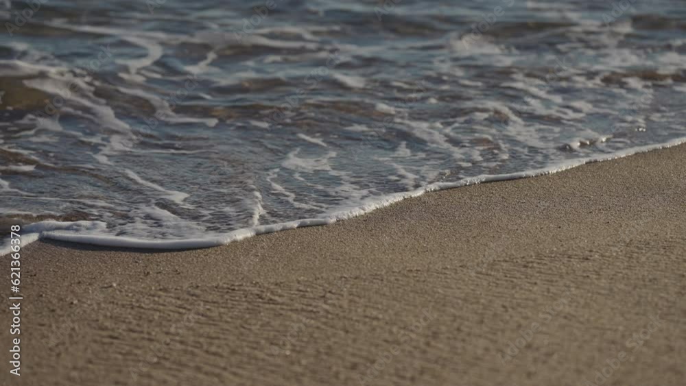 Slow motion handheld shot of evening waves on Cannes beach before sunset Slow motion handheld shot of evening waves on Cannes beach before sunset