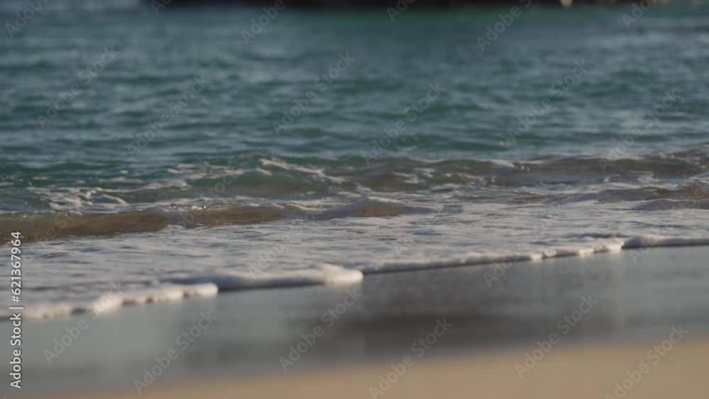 Slow motion handheld shot of evening waves on Cannes beach before sunset Slow motion handheld shot of evening waves on Cannes beach before sunset
