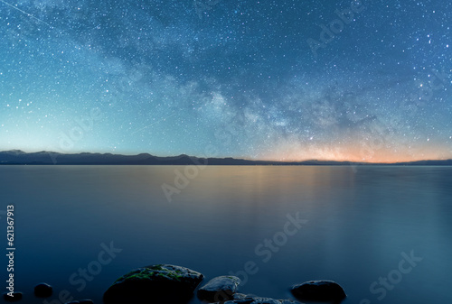 Beautiful night landscape,  bright Milky Way galaxy  on the lake.