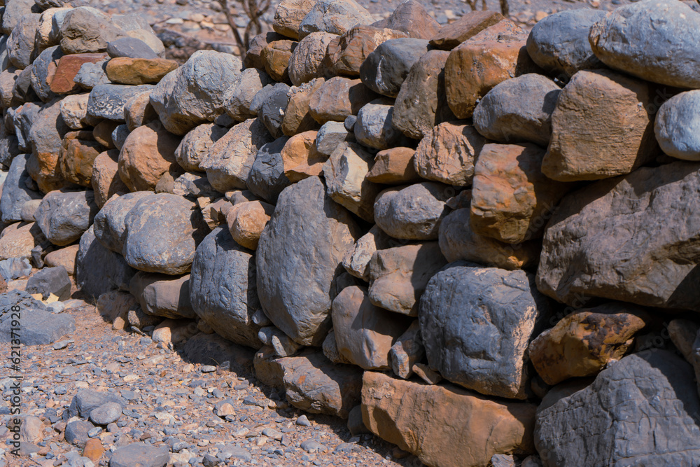 Man made stacked rock wall.