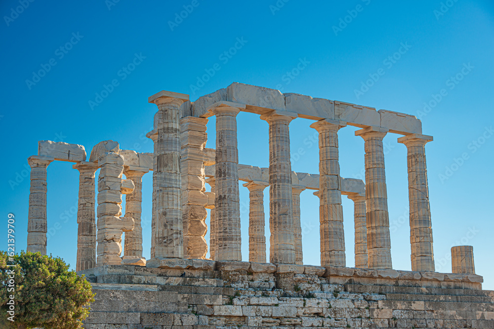 Greek Temple of Poseidon at sunset. Tourist landmark of Attica, Sounion, Greece 