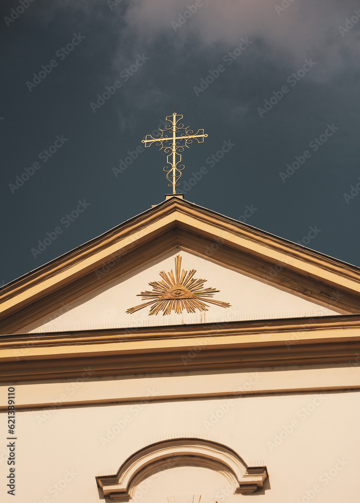 golden cross on the church