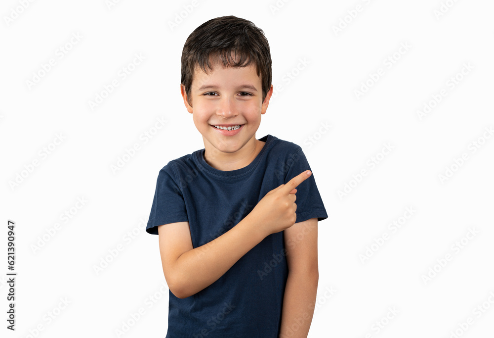 Little boy over isolated background smiling and looking at the camera pointing with one hand and fingers to the side. Little boy over isolated background smiling and looking at the camera pointing with one hand and fingers to the side.