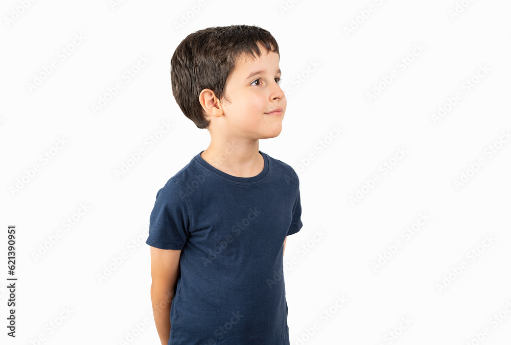 Child wearing casual t-shirt standing over white background looking away to side with smile on face, natural expression. Laughing confident. Child wearing casual t-shirt standing over white background looking away to side with smile on face, natural expression. Laughing confident.