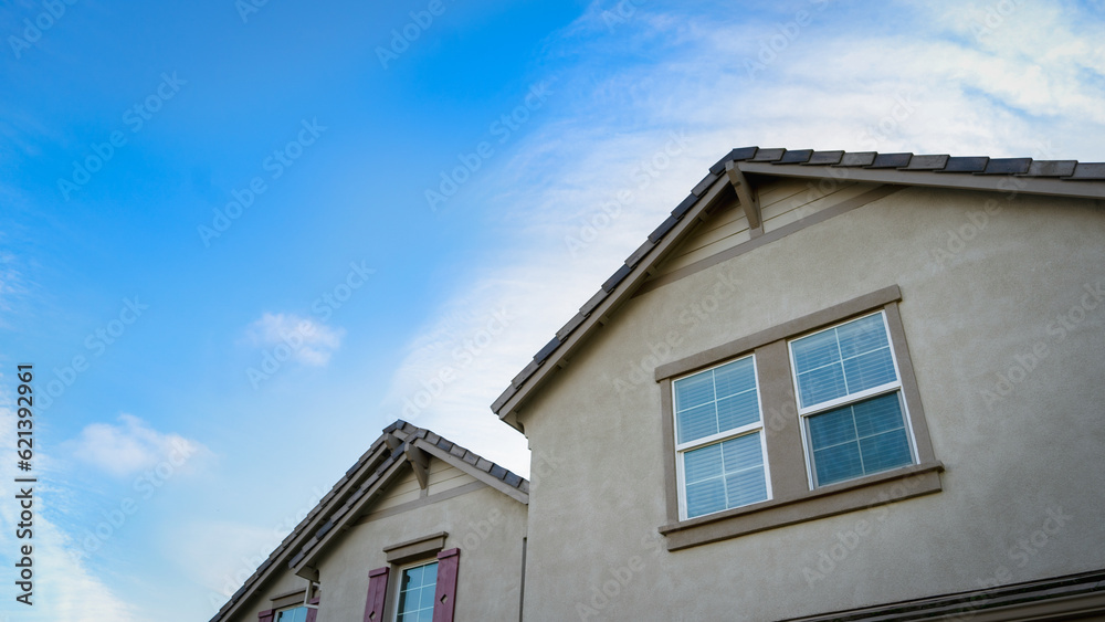 Top of a house with blue sky background