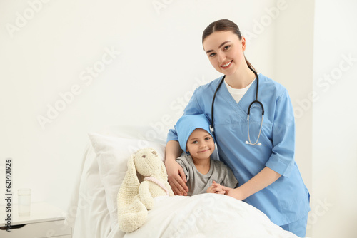 Fototapeta Naklejka Na Ścianę i Meble -  Childhood cancer. Doctor and little patient in hospital