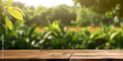 Empty wooden table top on blurred green nature garden background background. For product display montage