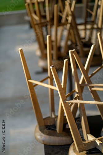 Upside down wood stools in a cafe