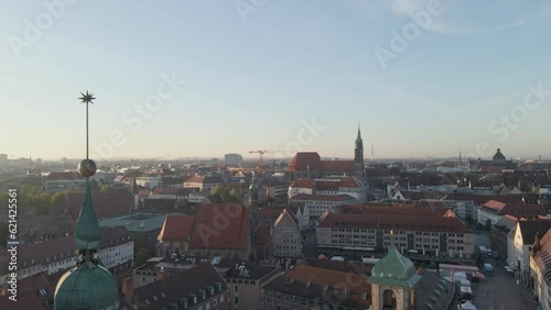 Flying over Nuremberg City Hall toward the main marketplace in Germany photo