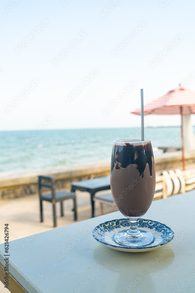 ice chocolate milkshake with sea background ice chocolate milkshake with sea background