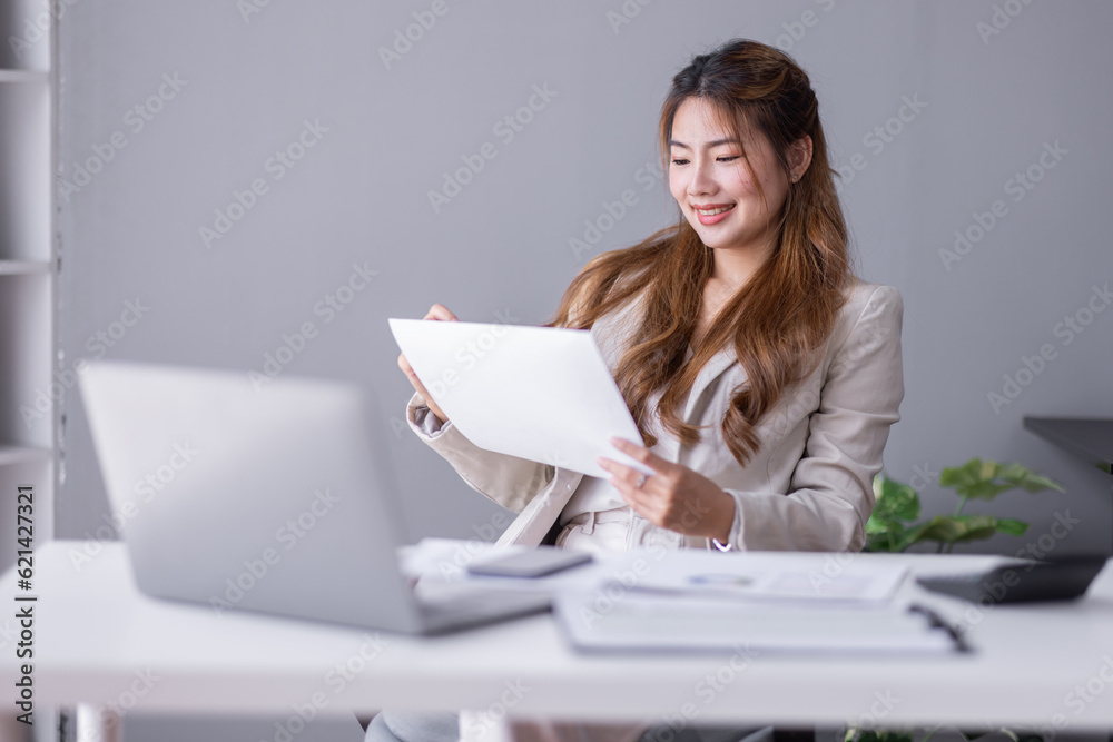 Business Documents, Auditor businesswoman checking searching document legal prepare paperwork or report for analysis TAX time, asian accountant Documents data contract partner deal in workplace office Business Documents, Auditor businesswoman checking searching document legal prepare paperwork or report for analysis TAX time, asian accountant Documents data contract partner deal in workplace office
