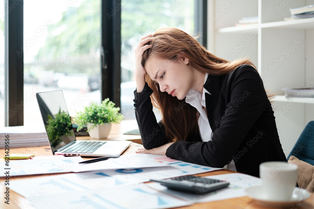 Business women are stressed while working on laptop, Tired asian businesswoman with headache at office, feeling sick at work, copy space Business women are stressed while working on laptop, Tired asian businesswoman with headache at office, feeling sick at work, copy space
