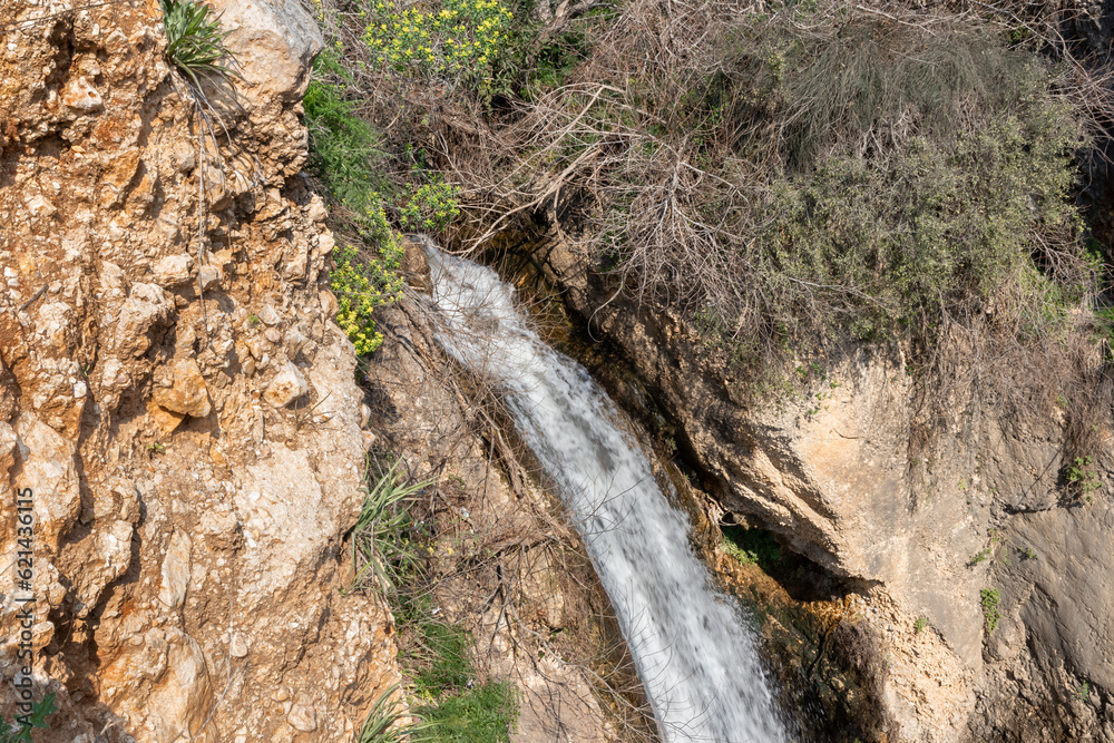 HaEshed waterfall flows from a crevice in the mountain and is located in the continuation of the rapid, shallow, cold mountain Ayun river, in the Galilee, near Metula city, in northern Israel HaEshed waterfall flows from a crevice in the mountain and is located in the continuation of the rapid, shallow, cold mountain Ayun river, in the Galilee, near Metula city, in northern Israel
