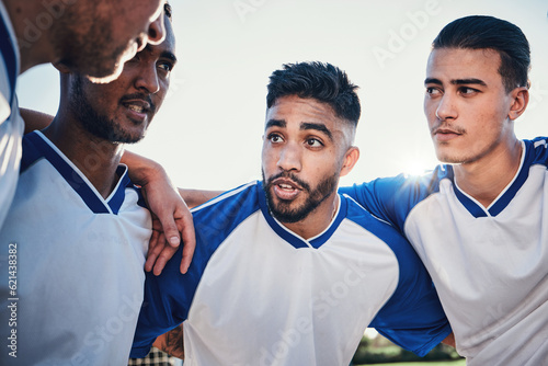 Motivation, football and team captain talking in a huddle planning match strategy for collaboration, teamwork and support. Group, discussion and soccer players in solidarity together for a game