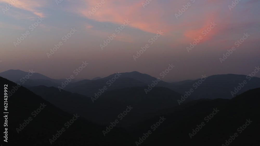 An aerial shot of the sky above a high-altitude mountain with a beautiful sunrise. An aerial shot of the sky above a high-altitude mountain with a beautiful sunrise.