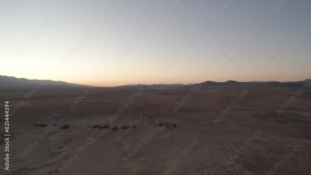 High aerial over sand dunes in dark blue hour in Johnson Valley California desert High aerial over sand dunes in dark blue hour in Johnson Valley California desert