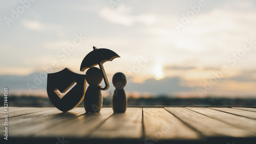 Fotografija Shield protect icon and family model with umbrella, Security protection and health insurance