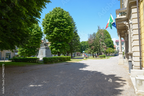Center of Tradate city, northern Italy and the public park in front of the town hall, square Mazzini