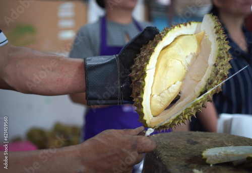 Merchant is peeling Durian, Thailand