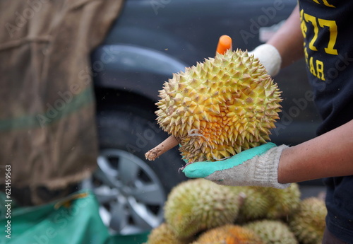 Merchant is peeling Durian, Thailand