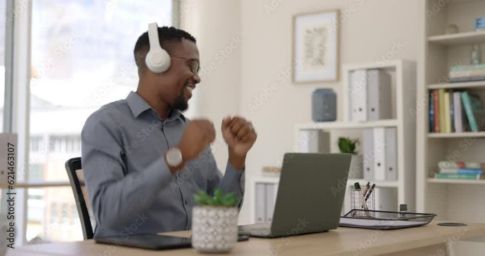 Headphones, laptop and businessman dancing in his office while listening to music, playlist or radio. Happy, technology and African male person moving to a song or album while working on a computer. Headphones, laptop and businessman dancing in his office while listening to music, playlist or radio. Happy, technology and African male person moving to a song or album while working on a computer.