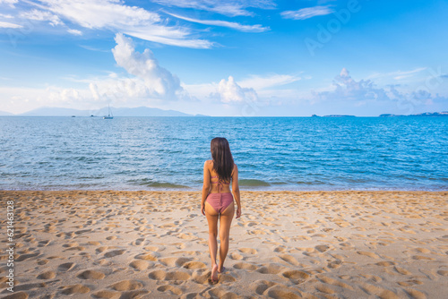 Traveler asian woman relax and travel on Bophut beach at day in Koh Samui Thailand summer season photo