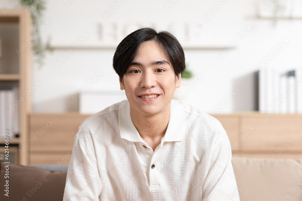 Asian handsome man standing cross arm looking at camera smile at home.Happy young smart businessman smile and confidence.Positive and good moment of asian male worker smile with wellness life Asian handsome man standing cross arm looking at camera smile at home.Happy young smart businessman smile and confidence.Positive and good moment of asian male worker smile with wellness life