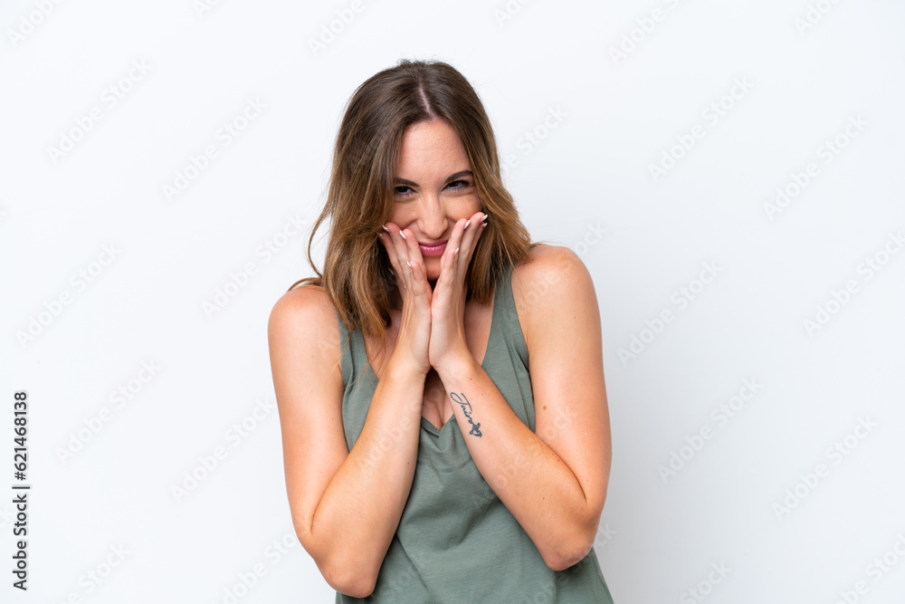 Young caucasian woman isolated on white background happy and smiling covering mouth with hands Young caucasian woman isolated on white background happy and smiling covering mouth with hands