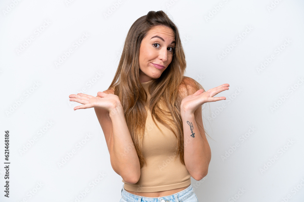 Young caucasian woman isolated on white background making doubts gesture Young caucasian woman isolated on white background making doubts gesture