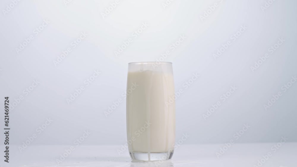 Ice Cubes Falling In A Glass Of Milk On White Background
Ice Cubes Falling In A Glass Of Milk On White Background
