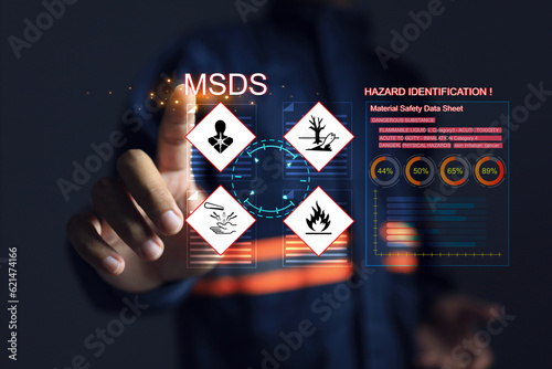 Safety officers pointing hands at the MSDS or material safety data sheet to indicate chemical information, basic antidotes or hazards to the body in area of use for emergency case safety work concept photo
