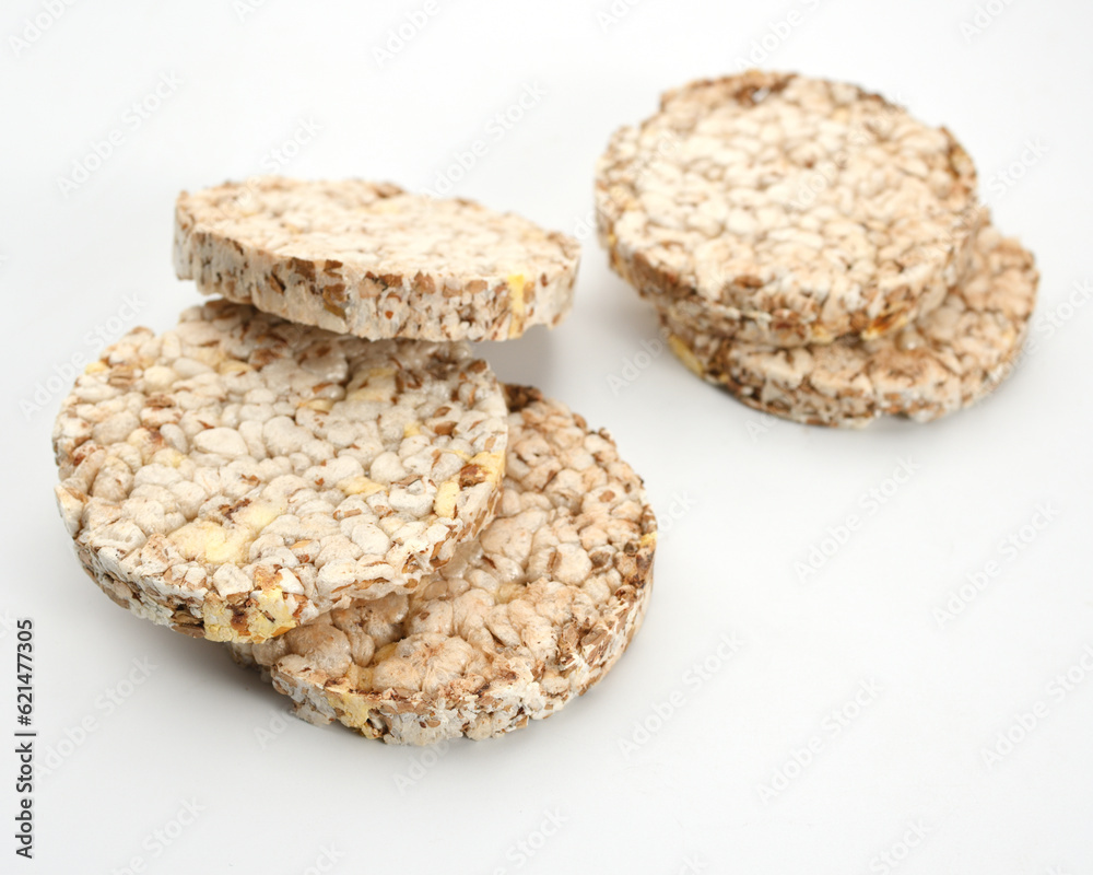healthy diet light and crispy bread without yeast from whole grains on a white background, close-up healthy diet light and crispy bread without yeast from whole grains on a white background, close-up