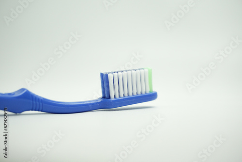 blue plastic toothbrush, the top view, sideways and in the long term, on a white background