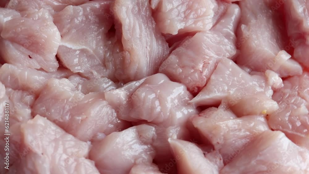 pieces of raw turkey meat , rotation in circle. fillet turkey Turning. selective focus pieces of raw turkey meat , rotation in circle. fillet turkey Turning. selective focus