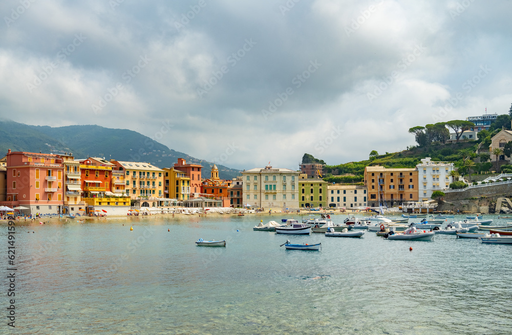 mediterranean coast in italy, against the backdrop of colorful houses on the seashore, many boats