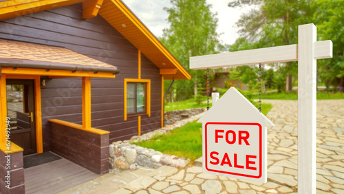 House for sale. Sign near c...