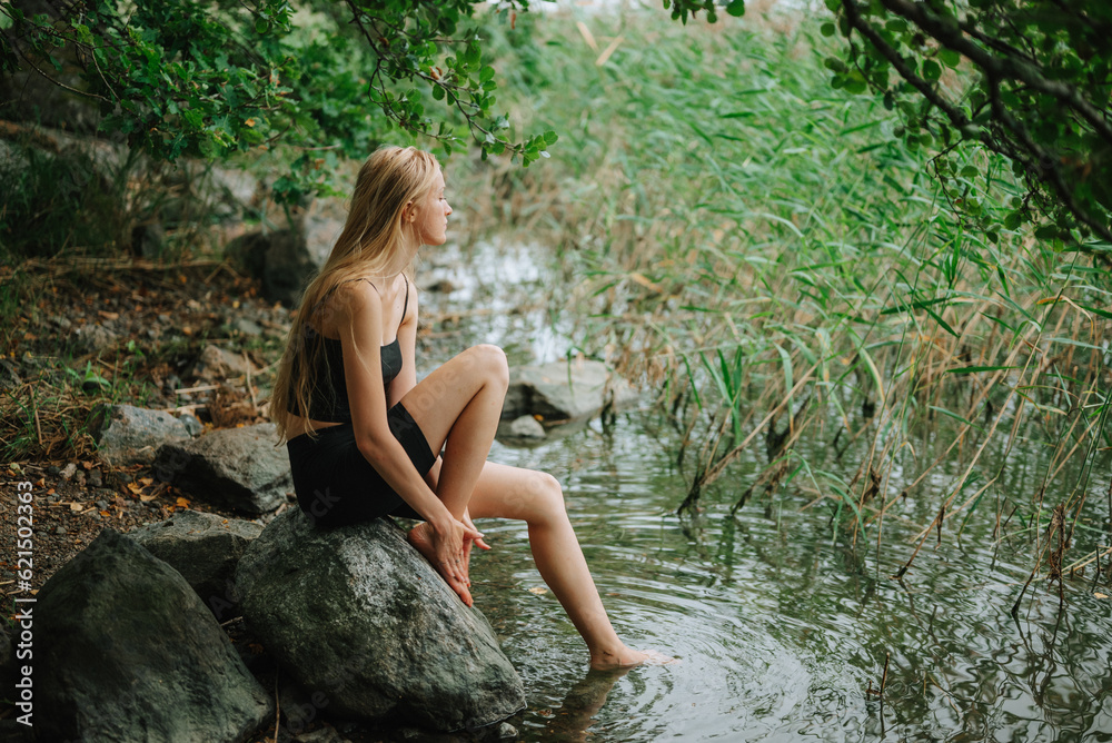 person sitting on the rocks