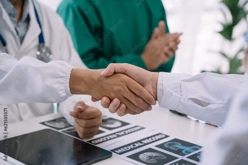 Doctor and Nursing assistant patient meeting at the hospital and shaking hands, healthcare and medicine banner in the morning. Doctor and Nursing assistant patient meeting at the hospital and shaking hands, healthcare and medicine banner in the morning.