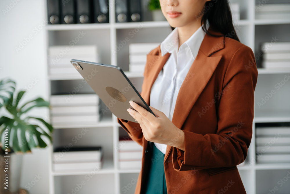 Working Process in Modern Office. Young Woman Account Manager Working at Table with New Business Project. Using Contemporary Laptop. Working Process in Modern Office. Young Woman Account Manager Working at Table with New Business Project. Using Contemporary Laptop.